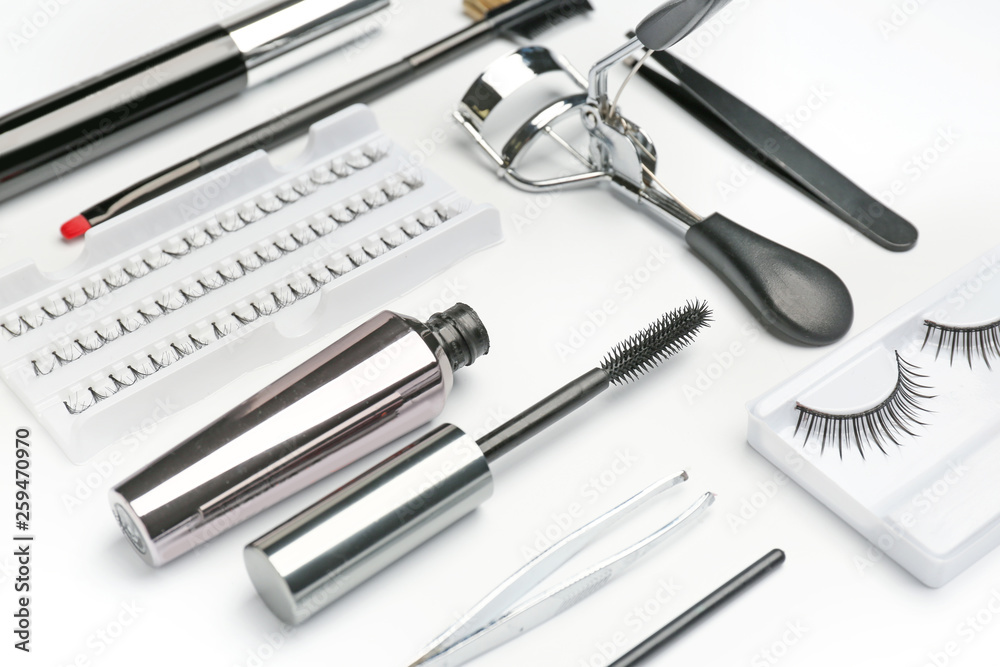 Mascara with false eyelashes and tools on white background Mascara with false eyelashes and tools on white background