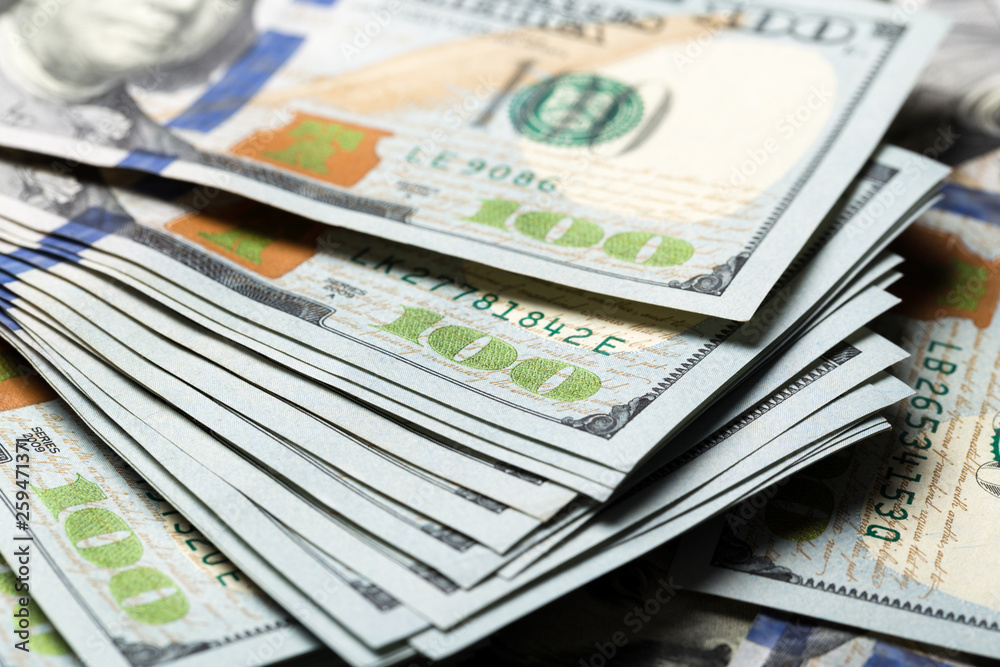 American dollars. A stack of hundred dollar bills. Close up American dollars. A stack of hundred dollar bills. Close up