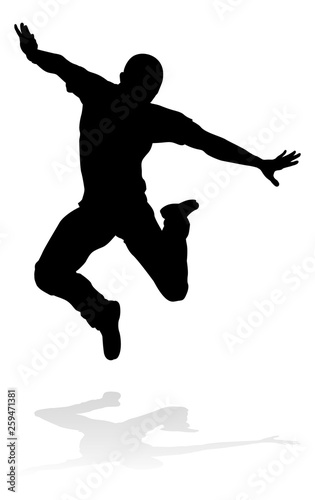 A male street dance hip hop dancer in silhouette photo
