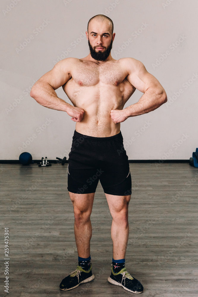Muscular guy in the gym Muscular guy in the gym