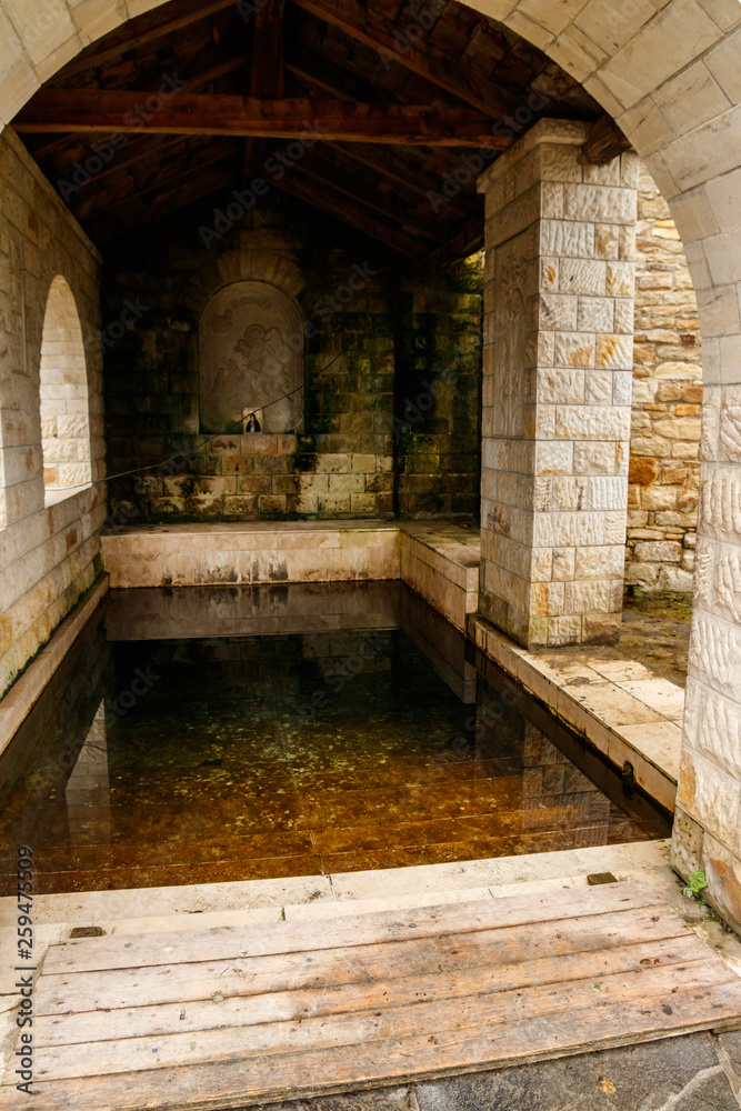 Fototapeta premium Holy spring in Lyadovsky rocky monastery, Ukraine