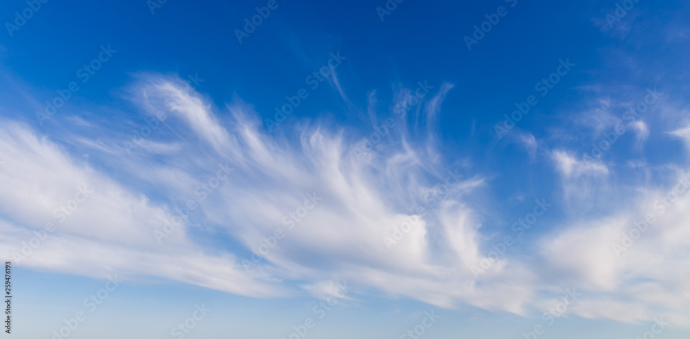 Clouds against the blue sky as a background Clouds against the blue sky as a background