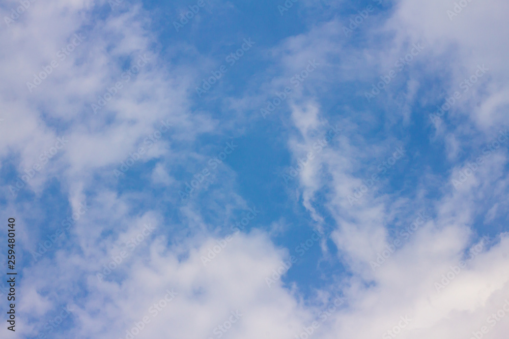 The blue sky has white clouds.