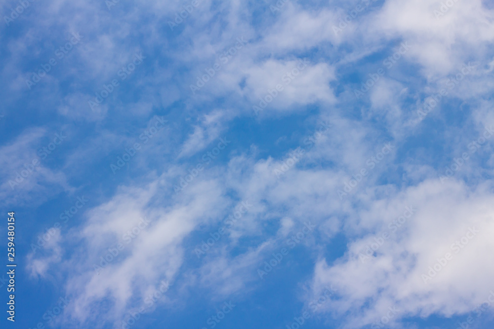 The blue sky has white clouds.