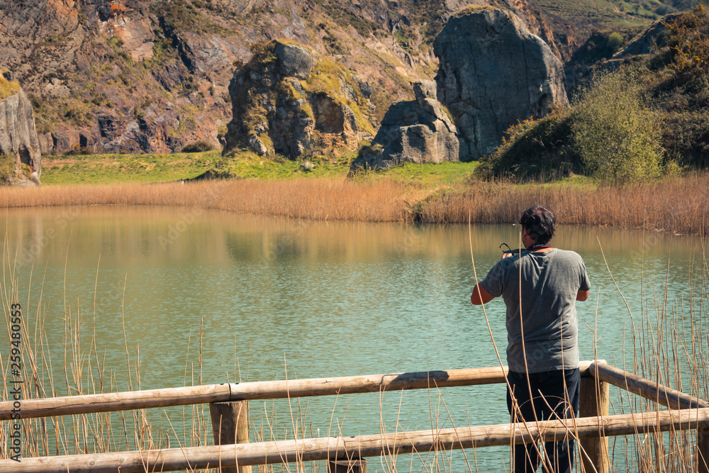 A young man alone on a lake, portrait, la arboleda, basque country