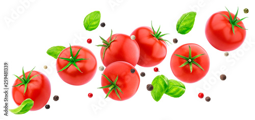 Falling tomatoes salad isolated on white background with clipping path, flying fresh vegetables ingredient