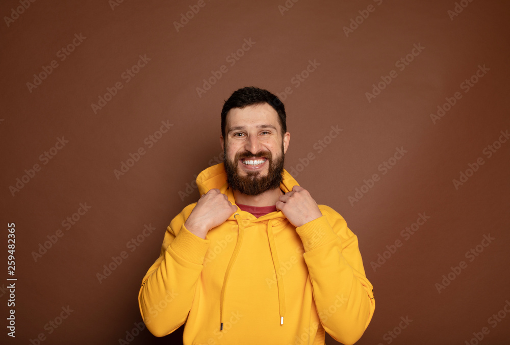 Horizontal close up portrait of a man with beard laughing on isolated color background Horizontal close up portrait of a man with beard laughing on isolated color background