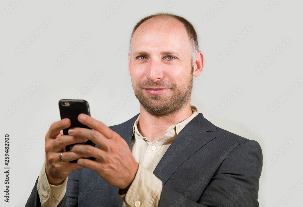 Naklejka premium confident successful businessman using mobile phone having doing online business with cellphone smiling cheerful in corporate job and entrepreneur success concept
