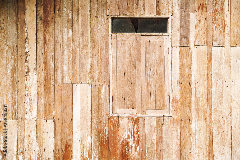 Old wooden walls and old wooden windows for the background, Wall of an old wooden house.