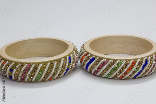 Close up of pair of bangles isolated on white background with space for text