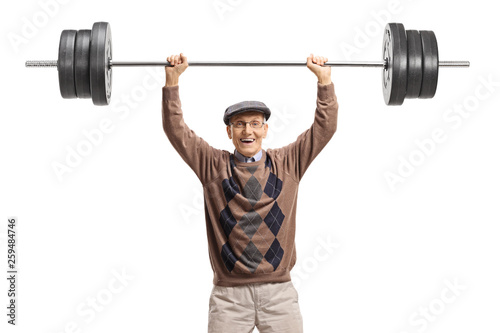Cheerful senior man lifting a barbell
