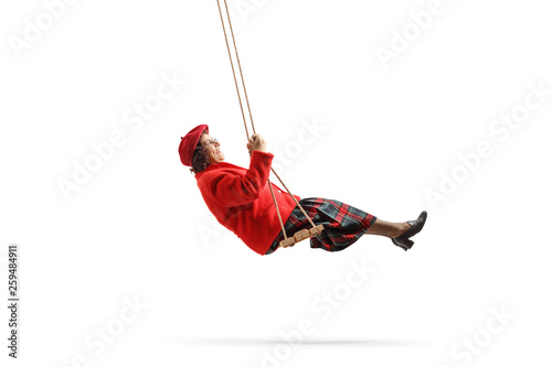 Old lady swinging and smiling