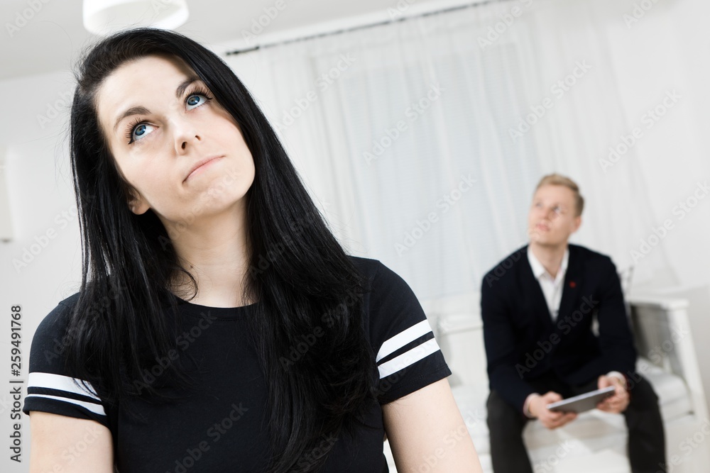 Active woman looking for inspiration and elegant man waiting in the background