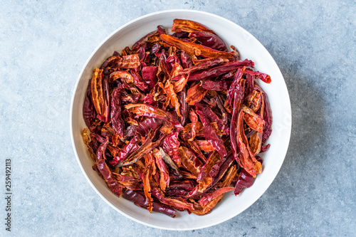 Stack of Dried Red Chili or Chilli Cayenne Pepper in Bowl.