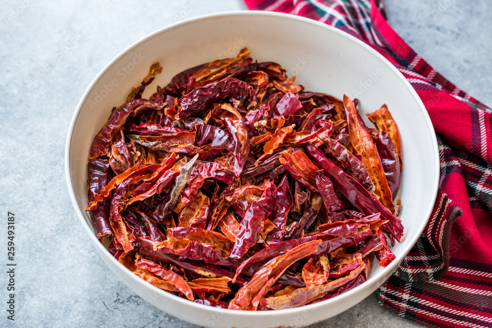 Stack of Dried Red Chili or Chilli Cayenne Pepper in Bowl. Stack of Dried Red Chili or Chilli Cayenne Pepper in Bowl.