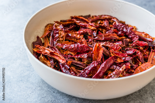 Stack of Dried Red Chili or Chilli Cayenne Pepper in Bowl.