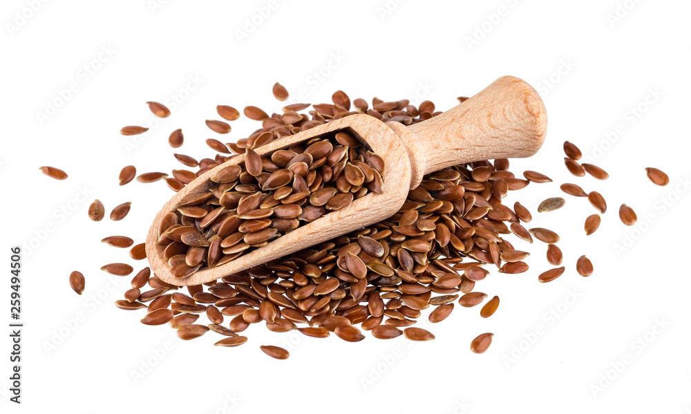 Pile of flax seeds isolated on white background, close-up of flaxseed in wooden scoop - obrazy, fototapety, plakaty 