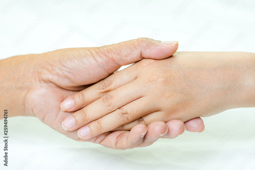 Fototapeta premium Asian senior and asian young holding hands.