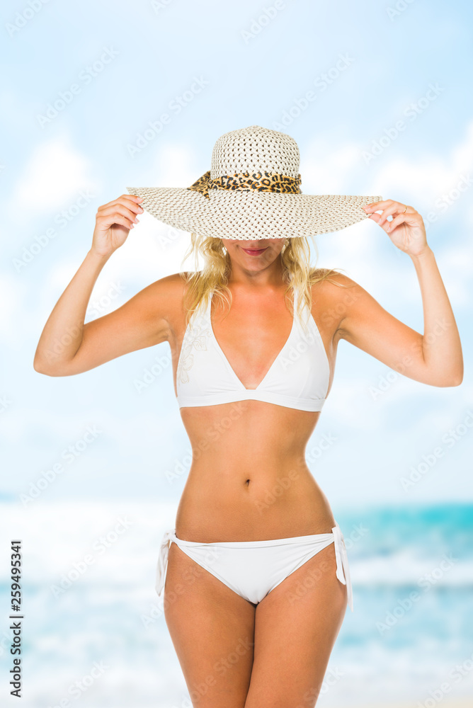 Woman enjoying her holidays on the tropical beach
