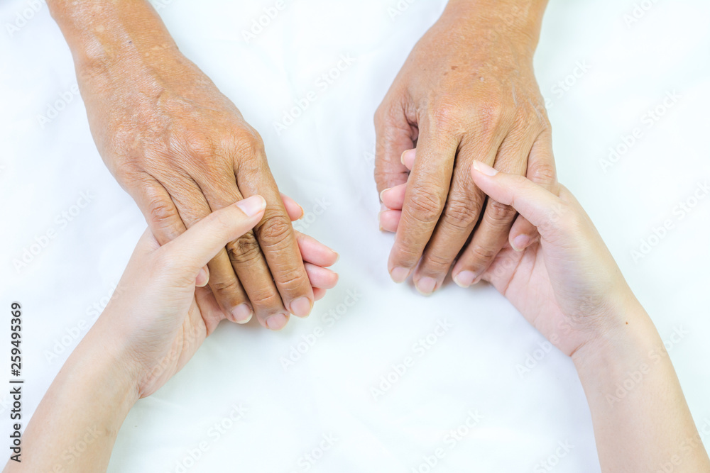 Asian senior and asian young holding hands. Asian senior and asian young holding hands.