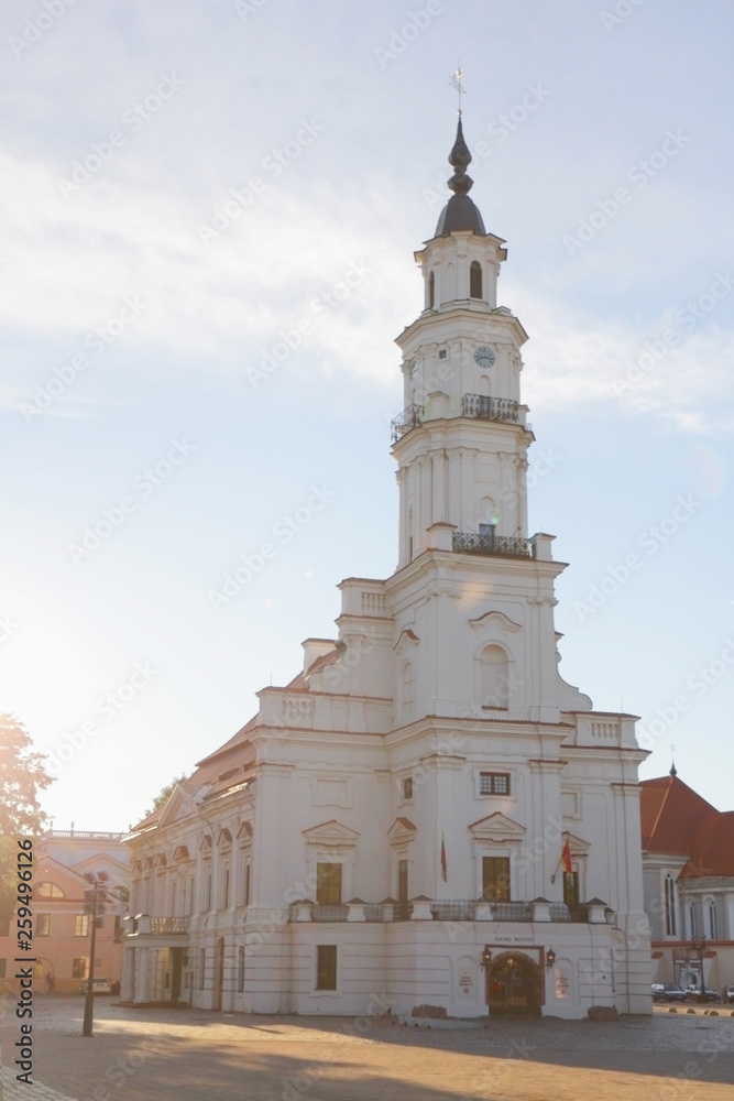 Town Hall in the center of Kaunas at the Town Hall Square in Lithuania against a blue sky with clouds.