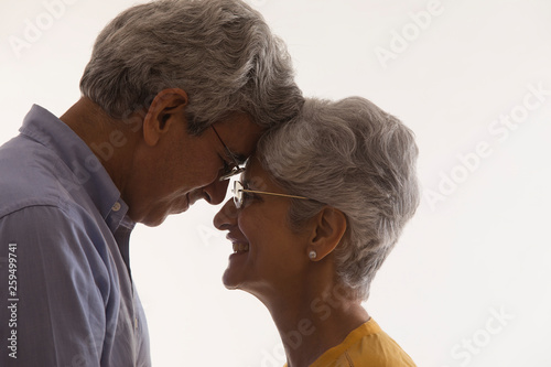 Portrait of senior couple touching foreheads 