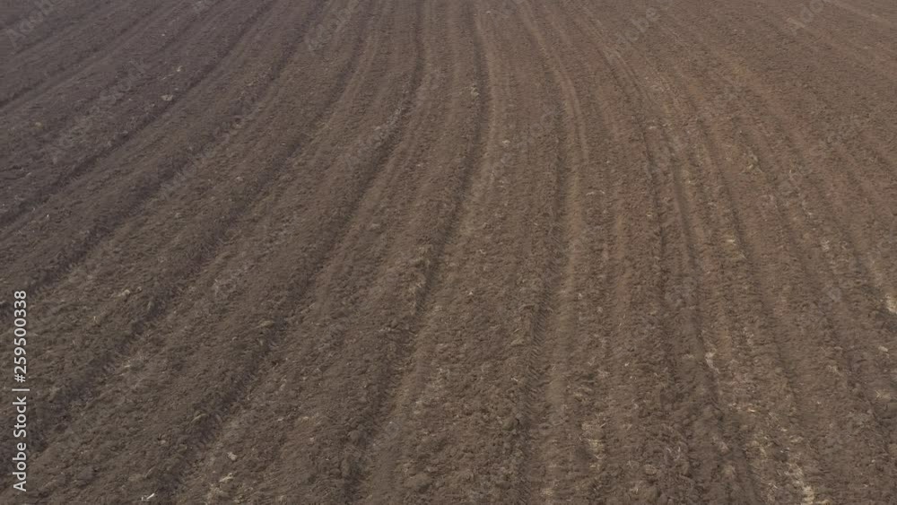 Agricultural soil ready for spring works 4K aerial video Agricultural soil ready for spring works 4K aerial video