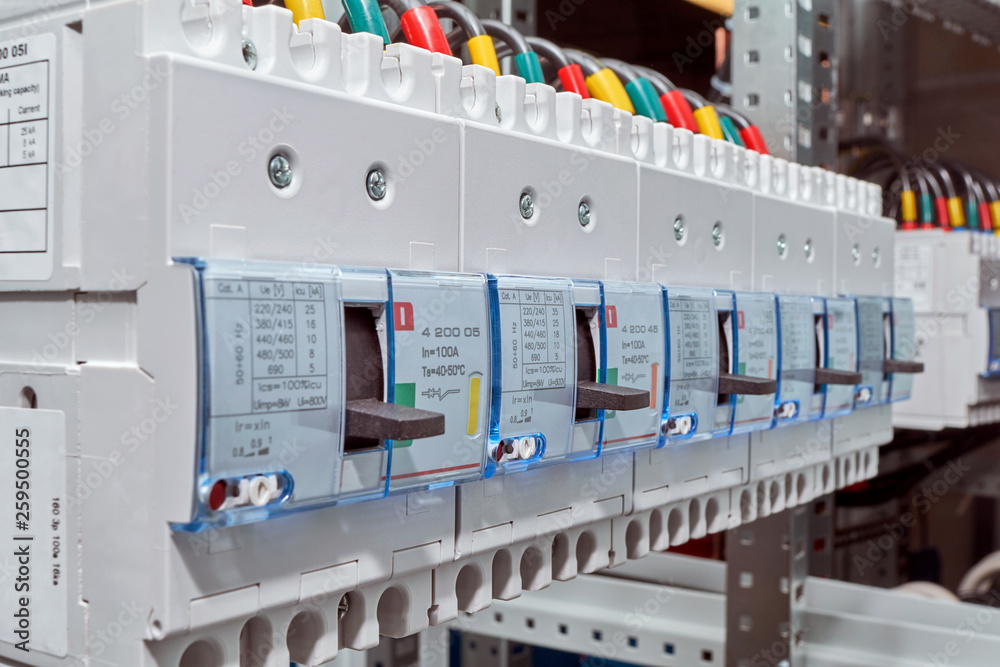 A range of large industrial electric circuit breakers. Modern reliable electrical equipment to protect electrical networks. Professional Assembly of electrical cabinets. Modern production.