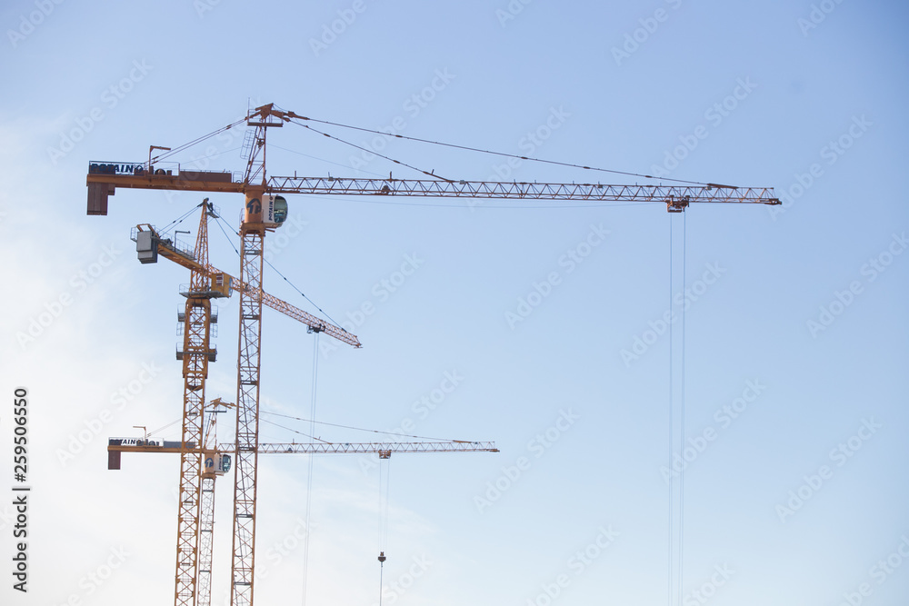 Lots of tower Construction site with cranes and building with blue sky background Lots of tower Construction site with cranes and building with blue sky background