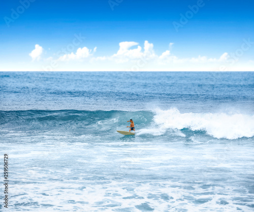 Summer time on beach and surfer on waves. 