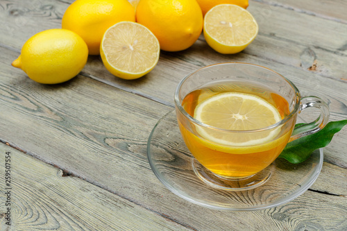 lemon tea with lemon and lime on wooden table