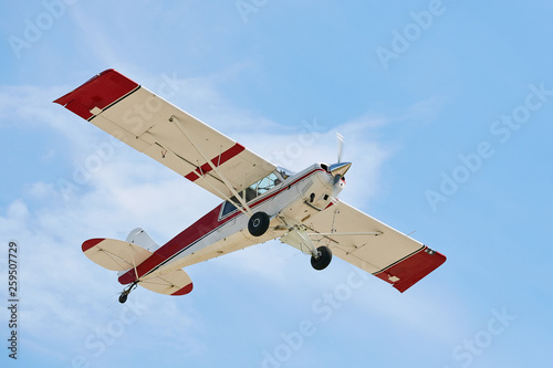 A small plane flies in the sky