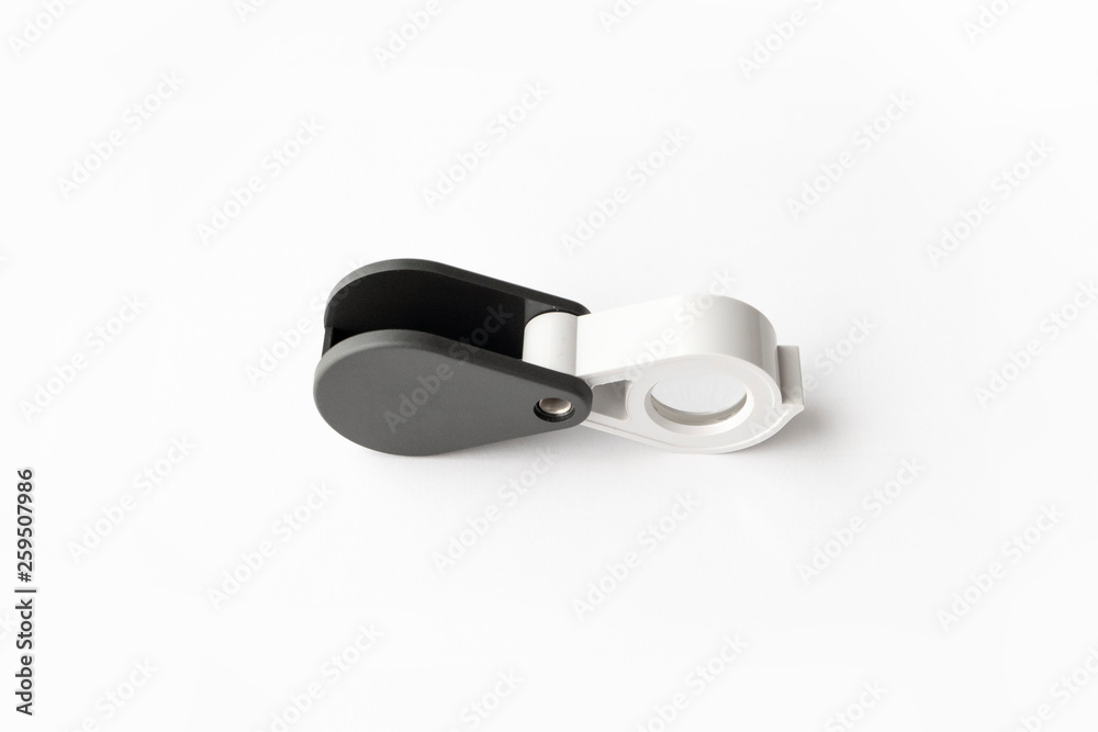 Magnifying glass for diamonds or see the amulet Isolated on a White Background. Magnifying glass for diamonds or see the amulet Isolated on a White Background.