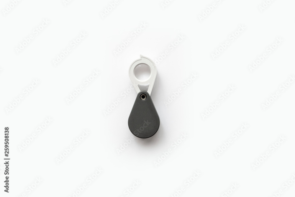 Magnifying glass for diamonds or see the amulet Isolated on a White Background. Magnifying glass for diamonds or see the amulet Isolated on a White Background.