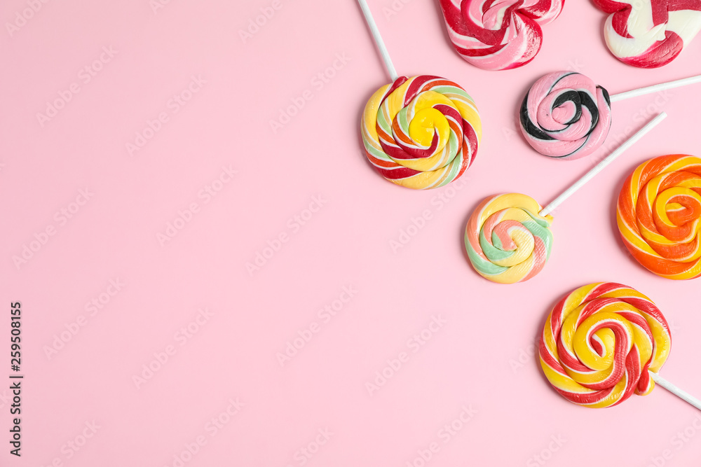 Flat lay composition with different candies and space for text on color background Flat lay composition with different candies and space for text on color background