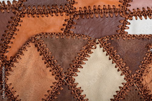 Fotografi Pieces of multi-colored leather stitched with thread