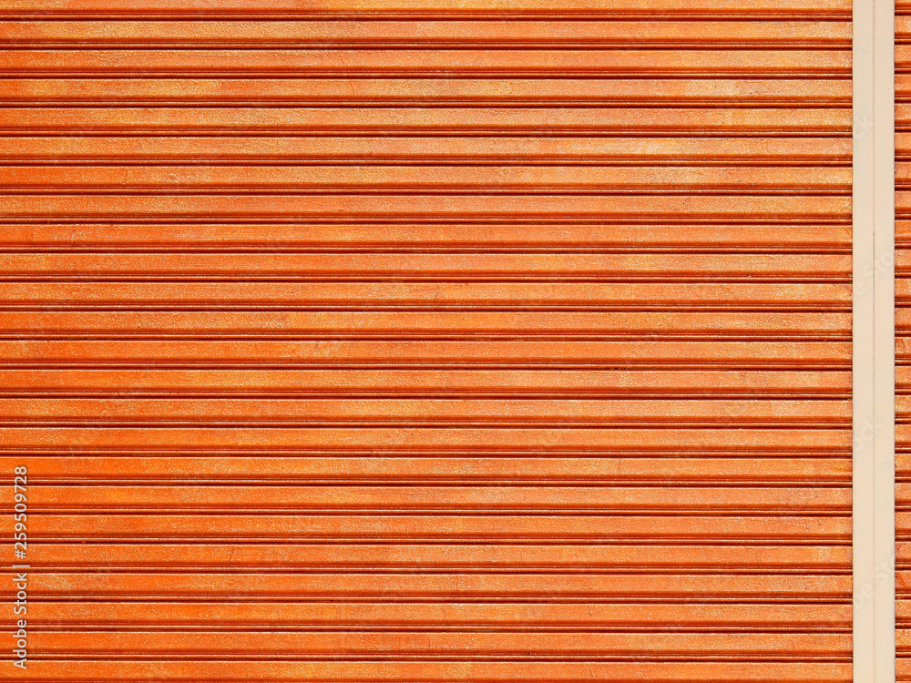 Obraz premium orange metal security roller door background