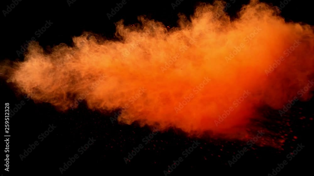 Super slow motion of orange powder explosion isolated on black background. Filmed on high speed cinema camera, 1000fps. Super slow motion of orange powder explosion isolated on black background. Filmed on high speed cinema camera, 1000fps.