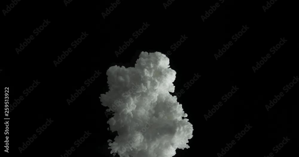 Slow motion of white dye spilling into clear liquid. Slow motion of white dye spilling into clear liquid.