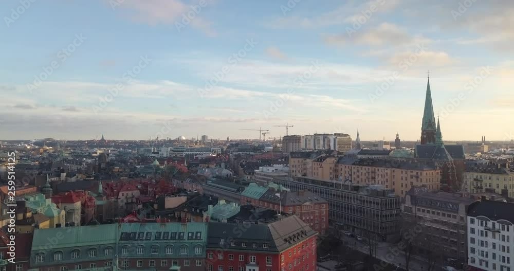Stunning aerial view early spring sunset Stockholm Sweden. Drone flies up over Ostermalm. Beautiful Swedish urban golden hour. Magnificent colorful cityscape. Stunning aerial view early spring sunset Stockholm Sweden. Drone flies up over Ostermalm. Beautiful Swedish urban golden hour. Magnificent colorful cityscape.
