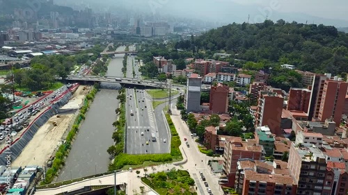 Flying over roads full of cars in Medellin, aerial 4k photo