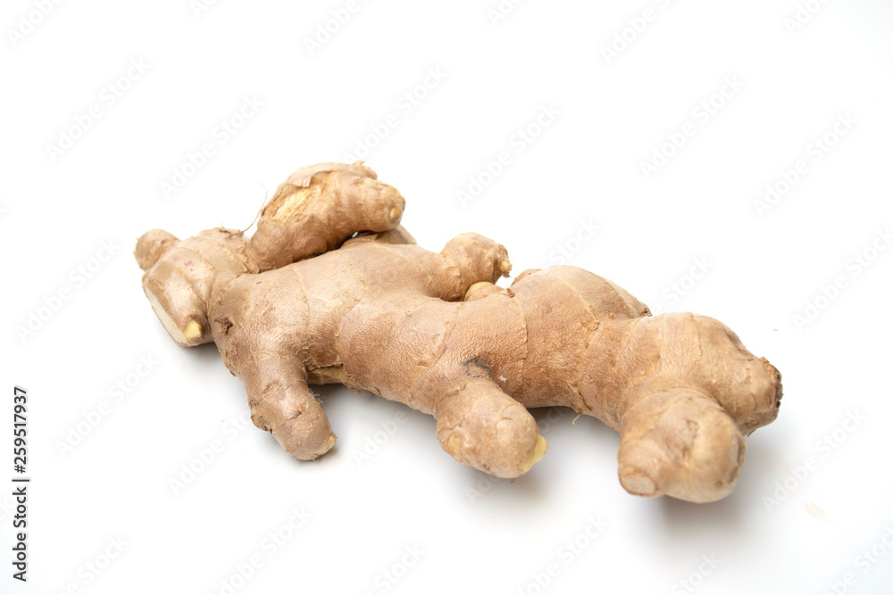 fresh ginger root closeup view, Thick tuberous vegetable with brown skin and pale yellow flesh on white background. fresh ginger root closeup view, Thick tuberous vegetable with brown skin and pale yellow flesh on white background.