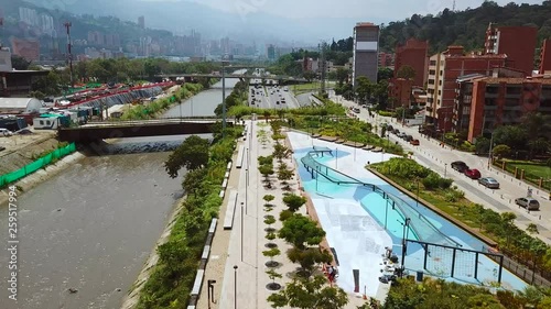 Slow aerial shot of park and busy traffic roads of Medellin, Laureles and Pueblo Paisa photo