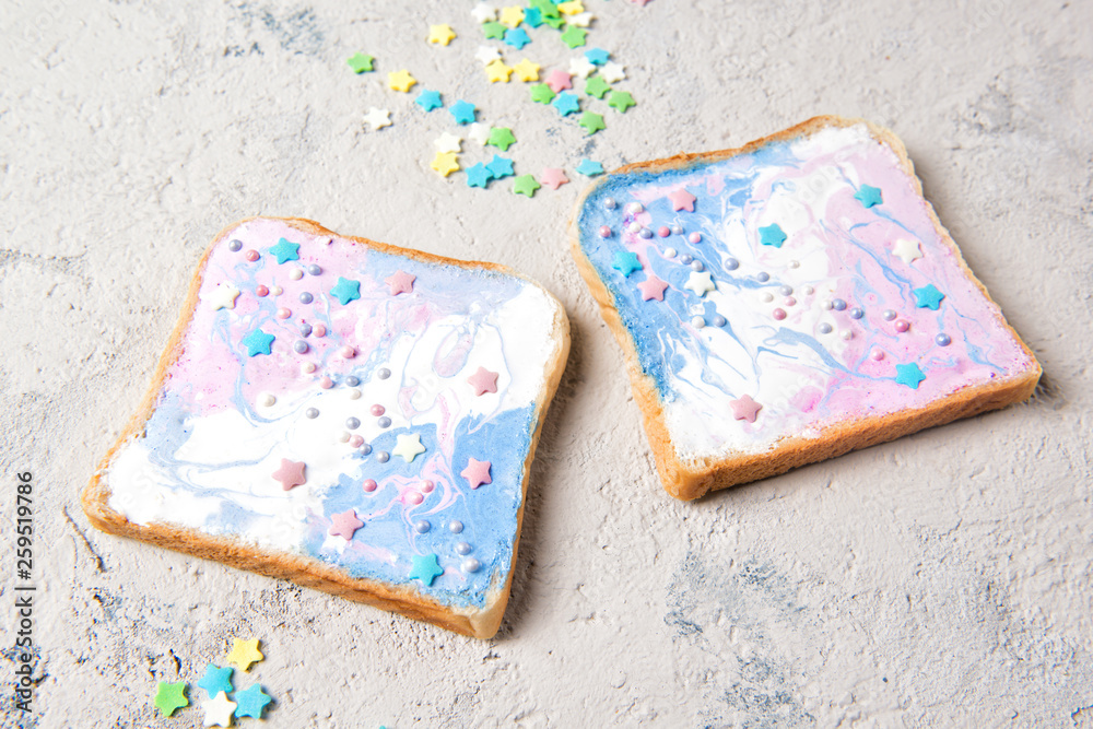 Unicorn or mermaid toasts with stars, food for kids idea, close up Unicorn or mermaid toasts with stars, food for kids idea, close up