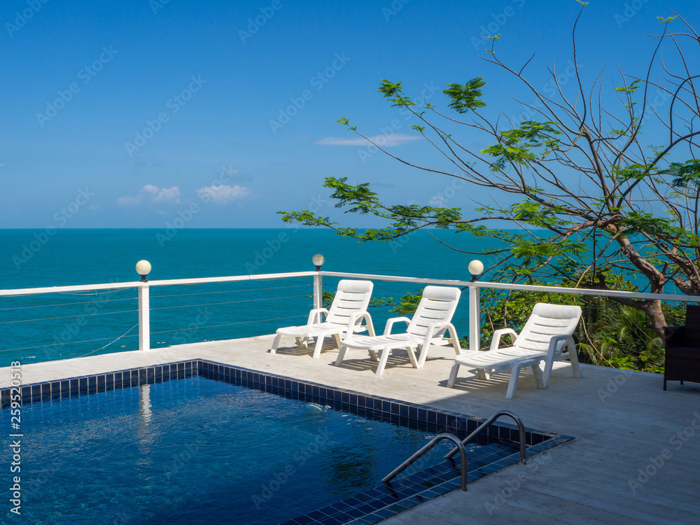 Fototapeta premium Swimming pool with palm trees