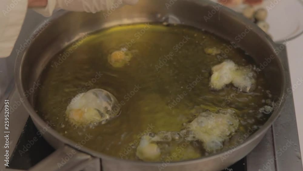 Hot skillet frying quail eggs Hot skillet frying quail eggs