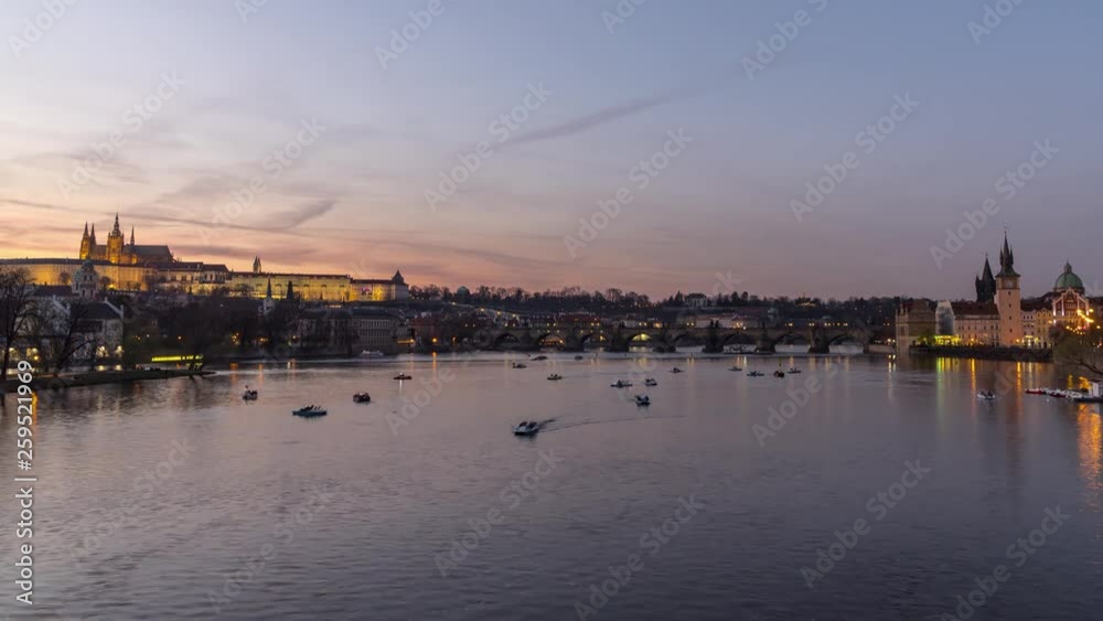 Timelapse of paddle boats on Vltava river in Prague with castle and Charles Bridge in the background, 4K static view Timelapse of paddle boats on Vltava river in Prague with castle and Charles Bridge in the background, 4K static view