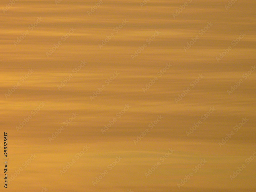 blur gold water with sunset
