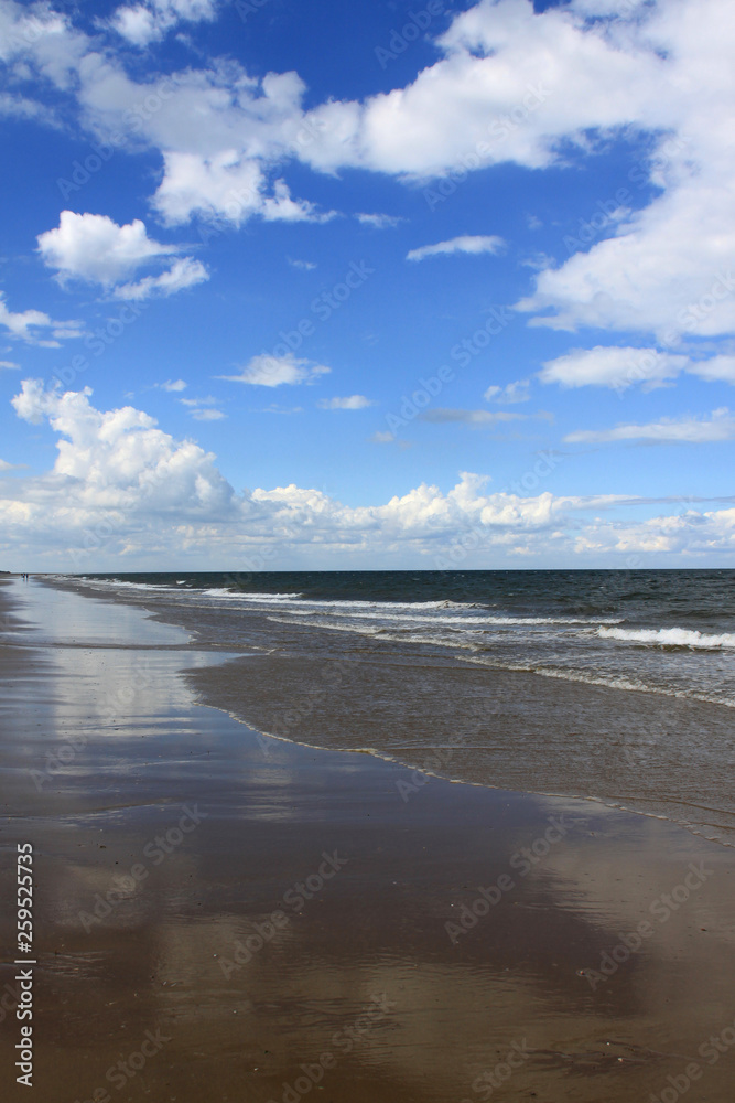 Empty sandy beach and horizon on the Norfolk coast UK