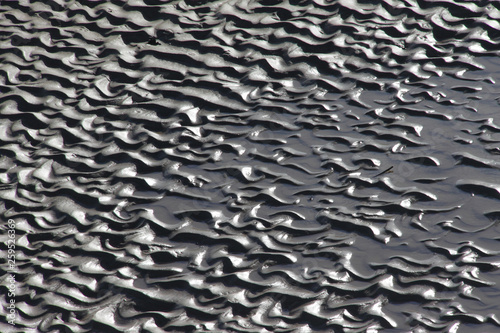 Patterns on the beach left by receding tide
